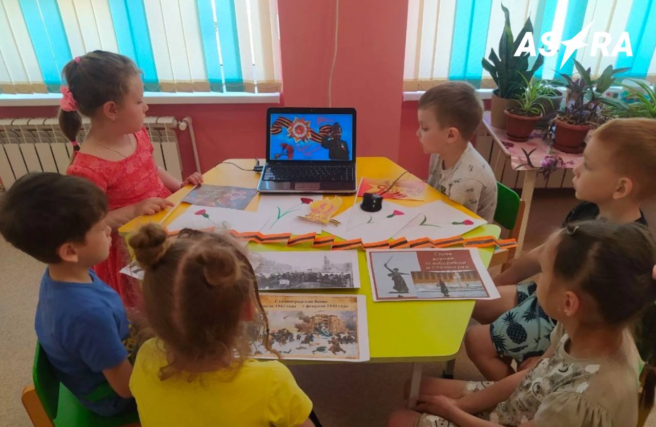 In Mariupol kindergarteners were dressed up in military uniforms, forced to march and sing “the shadow of war has long disappeared” in honor of May 9